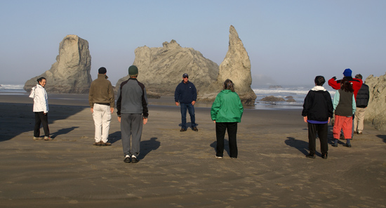 Morning qi gong on the Bandon beach.